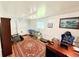 Office featuring a modern desk, comfortable chair and massage table at 8509 La Boca Ave, North Port, FL 34287