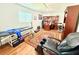 Office featuring a modern desk, comfortable chair and massage table at 8509 La Boca Ave, North Port, FL 34287