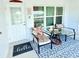 Cozy porch setting features comfortable seating and a clear view, perfect for relaxing and enjoying the surroundings at 8509 La Boca Ave, North Port, FL 34287