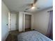 Bedroom with ceiling fan, carpet, and closet with folding doors at 931 Signet Dr, Apollo Beach, FL 33572