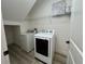Functional laundry room with modern washer and dryer, plus convenient shelving at 931 Signet Dr, Apollo Beach, FL 33572
