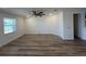 Spacious living room featuring wood-look floors, white walls, and a ceiling fan at 931 Signet Dr, Apollo Beach, FL 33572