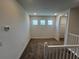 Cozy loft with recessed lighting, carpeting and multiple windows for natural light at 931 Signet Dr, Apollo Beach, FL 33572