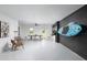Spacious basement featuring recreation area, bike rack, and modern finishes at 9990 Key Haven Rd, Seminole, FL 33777