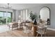 Bright living room with modern decor, hardwood floors, and access to a balcony at 9990 Key Haven Rd, Seminole, FL 33777