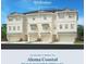 New construction three-story townhome showcasing a contemporary design with a two-car garage and white siding at 9992 Key Haven Rd, Seminole, FL 33777