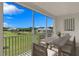 Beautiful outdoor dining area with a view of the lush green lawn and clear blue sky at 9992 Key Haven Rd, Seminole, FL 33777