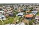 Expansive aerial shot showcasing the property's spacious yard, mature trees, and neighborhood at 103 Graham Se St, Port Charlotte, FL 33952