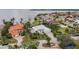 Beautiful waterfront home with mature landscaping, palm trees, and close proximity to the bay, offering a coastal lifestyle at 103 Graham Se St, Port Charlotte, FL 33952
