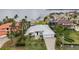 Coastal home with lush landscaping, paved driveway, and scenic water views, offering a serene waterfront living experience at 103 Graham Se St, Port Charlotte, FL 33952