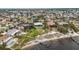 Beautiful property with beach access, verdant lawn, and waterside location from above at 103 Graham Se St, Port Charlotte, FL 33952