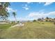 Beautiful backyard space with green grass, and seating with a waterfront view at 103 Graham Se St, Port Charlotte, FL 33952