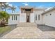 Inviting home entrance with stone steps, dark wood doors, and manicured front yard landscaping at 103 Graham Se St, Port Charlotte, FL 33952