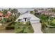 Beautiful single Gathering home with lush green lawn and lovely palms at 103 Graham Se St, Port Charlotte, FL 33952