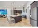 Well-lit kitchen features a large island, stainless steel appliances, and pendant lighting at 103 Graham Se St, Port Charlotte, FL 33952
