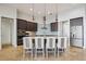 Spacious kitchen with a central island, pendant lights, stainless steel appliances, and adjacent breakfast bar seating at 103 Graham Se St, Port Charlotte, FL 33952