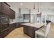 Bright kitchen with stainless steel appliances, a large island, and sleek cabinetry with modern hardware at 103 Graham Se St, Port Charlotte, FL 33952