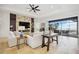Bright and airy living room featuring tile floors and open floor plan with modern furnishings at 103 Graham Se St, Port Charlotte, FL 33952