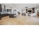 Open concept living space with a modern kitchen, living area, and access to the home's musical and entertaining space at 103 Graham Se St, Port Charlotte, FL 33952