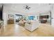 Bright and airy living room featuring tile floors and open floor plan with modern furnishings at 103 Graham Se St, Port Charlotte, FL 33952