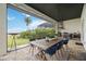 Outdoor dining area with a grill, perfect for entertaining with a beautiful waterfront backdrop at 103 Graham Se St, Port Charlotte, FL 33952