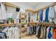 Spacious walk-in closet with many shelves, wooden storage and an open window at 103 Graham Se St, Port Charlotte, FL 33952