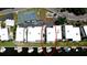 Aerial view showcasing canal-front homes with boat docks, a tennis court, and well-maintained landscaping at 10311 Waterbird Way, Bradenton, FL 34209