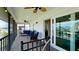 Spacious screened-in patio with comfortable seating and scenic waterfront views, ideal for relaxing and entertaining at 10311 Waterbird Way, Bradenton, FL 34209