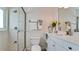 Clean bathroom with shower, toilet and white vanity with marble countertop at 10311 Waterbird Way, Bradenton, FL 34209