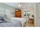 Bright bedroom offers a dedicated workspace and an abundance of natural light through a large window at 10311 Waterbird Way, Bradenton, FL 34209
