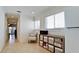 Hallway with seating area, extra storage, and views to the living room at 10311 Waterbird Way, Bradenton, FL 34209