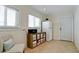 Hallway with storage, stainless steel refrigerator, and adjacent exterior door at 10311 Waterbird Way, Bradenton, FL 34209