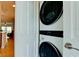 Modern laundry area features a stacked washer and dryer, providing convenience and saving space at 10311 Waterbird Way, Bradenton, FL 34209