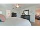 Primary bedroom with tile flooring and view into bathroom and sitting room at 10311 Waterbird Way, Bradenton, FL 34209