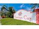 Welcome to Flamingo Cay! Attractive community sign surrounded by green foliage, creating a welcoming entrance to this beautiful neighborhood at 10311 Waterbird Way, Bradenton, FL 34209