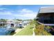 Scenic waterfront view of condos, private boat slips, and colorful tropical foliage at 10311 Waterbird Way, Bradenton, FL 34209