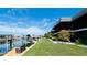Beautiful waterfront condos with boat slips, manicured lawn, and tropical flowers at 10311 Waterbird Way, Bradenton, FL 34209