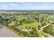 An aerial view highlights the home's ideal location within a well-planned community, surrounded by other homes and ponds at 18307 White Fang Ct, Parrish, FL 34219