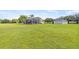 View of a sparkling in-ground pool and back yard with lush lawns, perfect for outdoor activities and entertaining at 18307 White Fang Ct, Parrish, FL 34219