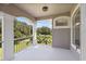 Enjoy outdoor living on this covered balcony with views of the landscaped backyard at 18307 White Fang Ct, Parrish, FL 34219