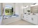 Bathroom featuring a soaking tub and modern fixtures at 18307 White Fang Ct, Parrish, FL 34219