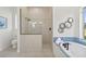 Bathroom featuring a standalone shower and soaking tub at 18307 White Fang Ct, Parrish, FL 34219
