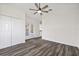 Bedroom with hard surface floors with closet and french door access to back porch at 18307 White Fang Ct, Parrish, FL 34219