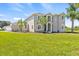 Stately two-story home with lush landscaping, manicured lawn, and mature trees at 18307 White Fang Ct, Parrish, FL 34219