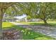 Beautiful two-story home with an oversized front yard and long driveway leading to the house at 18307 White Fang Ct, Parrish, FL 34219