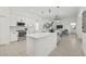 Bright, open kitchen with stainless steel appliances, modern cabinetry, and a large center island at 18307 White Fang Ct, Parrish, FL 34219