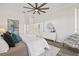 Comfortable main bedroom with a large ceiling fan, stylish furniture, and ample natural light at 18307 White Fang Ct, Parrish, FL 34219
