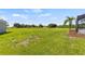 A expansive lawn in the backyard offers ample space for recreation and outdoor activities at 18307 White Fang Ct, Parrish, FL 34219