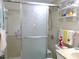The bathroom features a shower with sliding doors, tiled walls, and fun decorations at 1850 Sunny Dr # F4, Bradenton, FL 34207