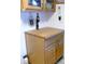 Kitchen storage with wooden butcher block countertop and unique cabinet hardware at 1850 Sunny Dr # F4, Bradenton, FL 34207